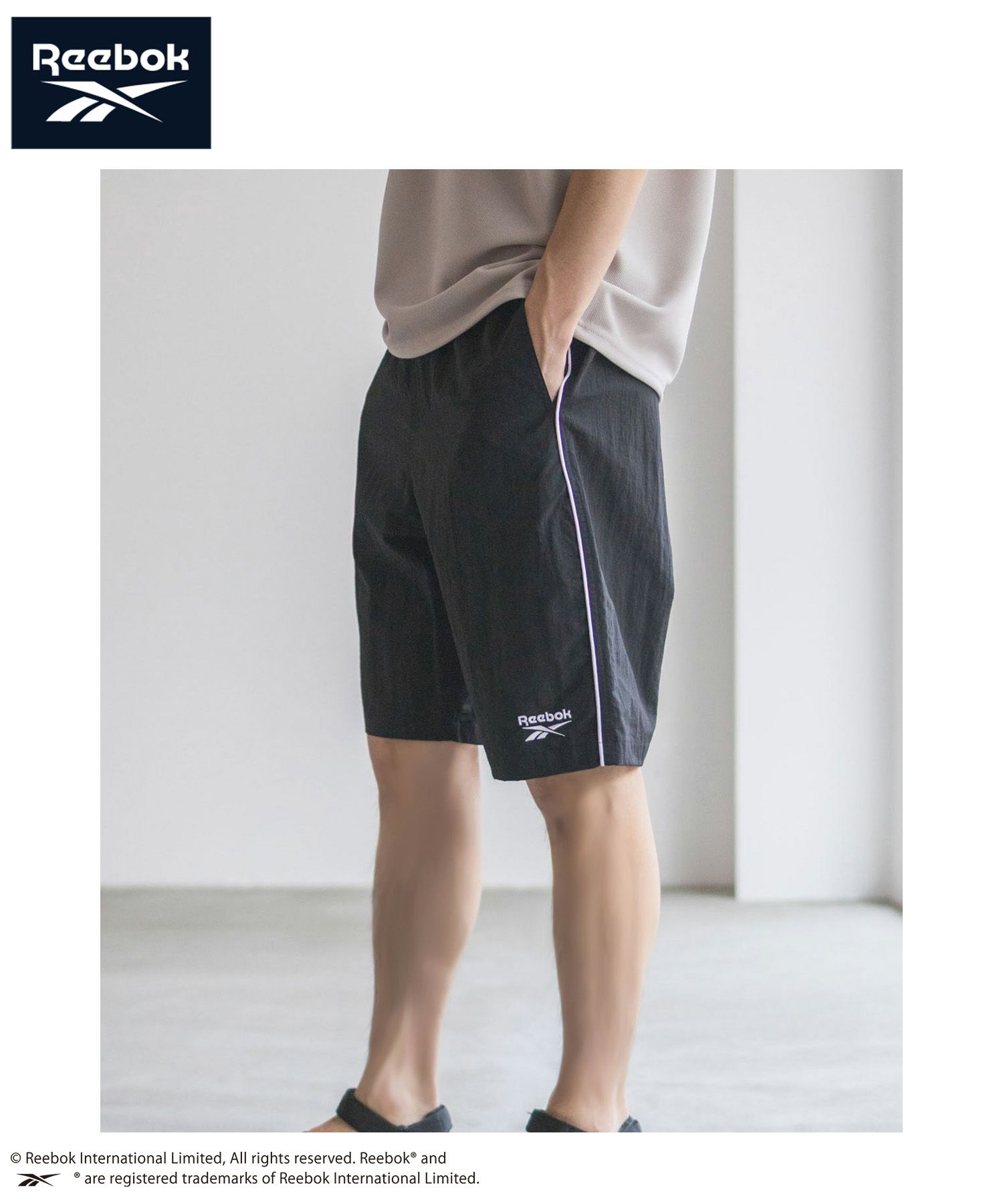 Reebok ナイロンパイピングショートパンツ メンズ