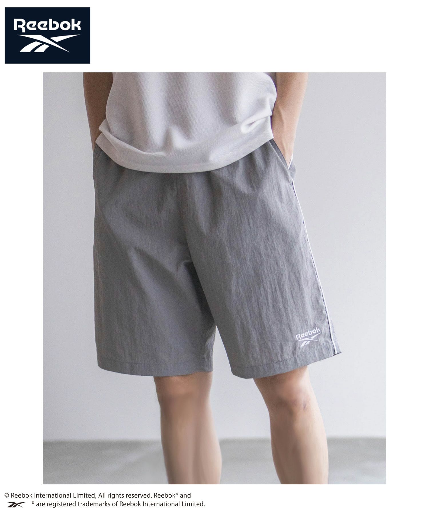 Reebok ナイロンパイピングショートパンツ メンズ