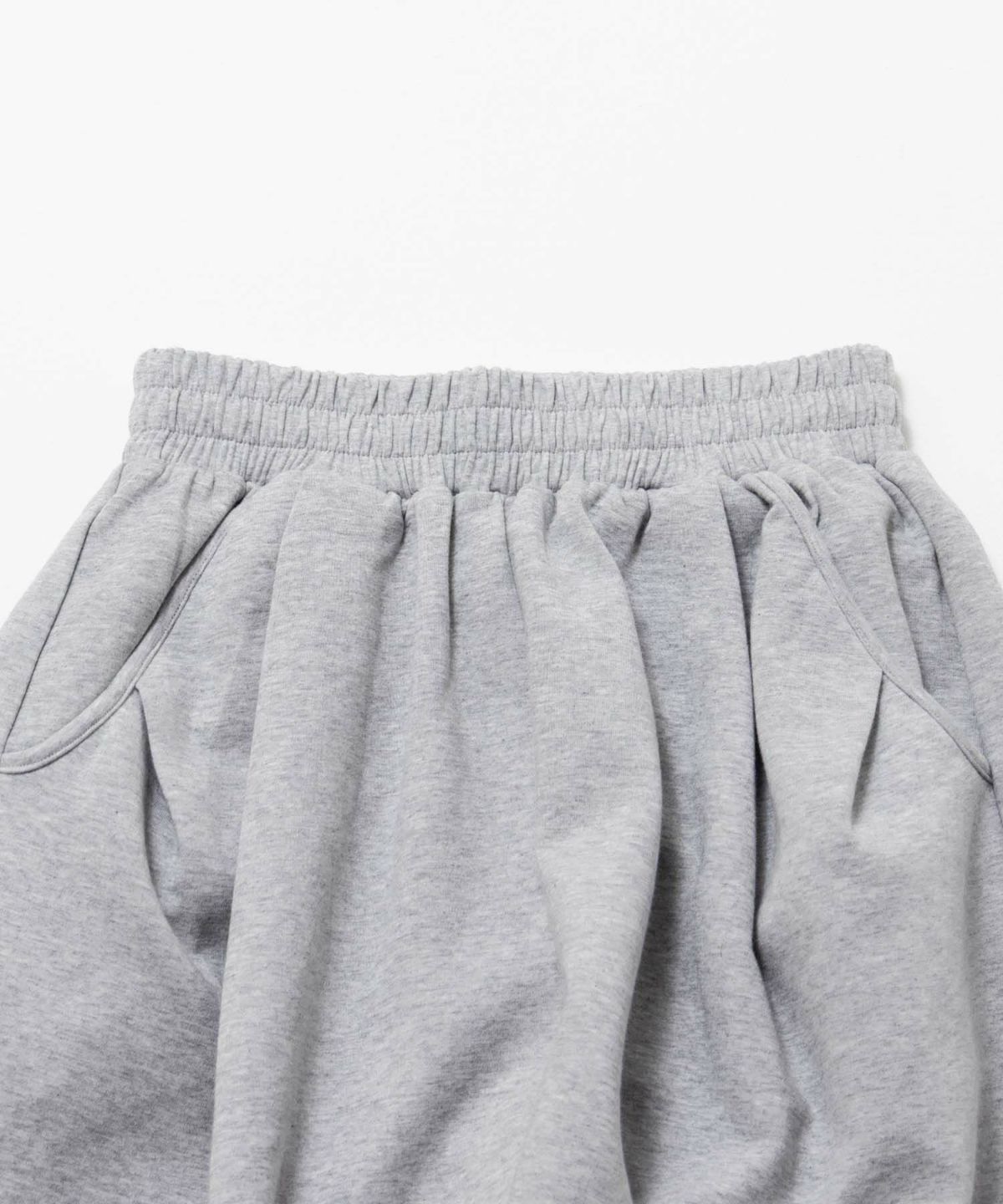 milli de l'air ポンチ素材 リラックスカーブパンツ レディース