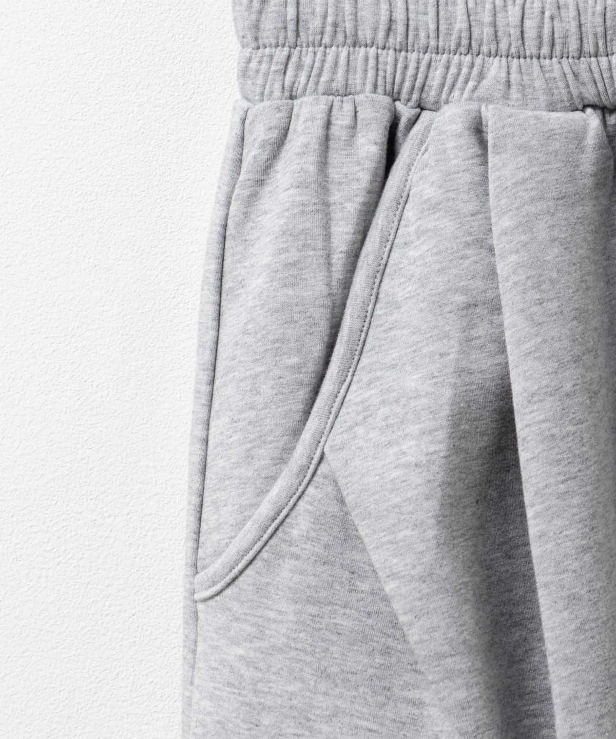 milli de l'air ポンチ素材 リラックスカーブパンツ レディース