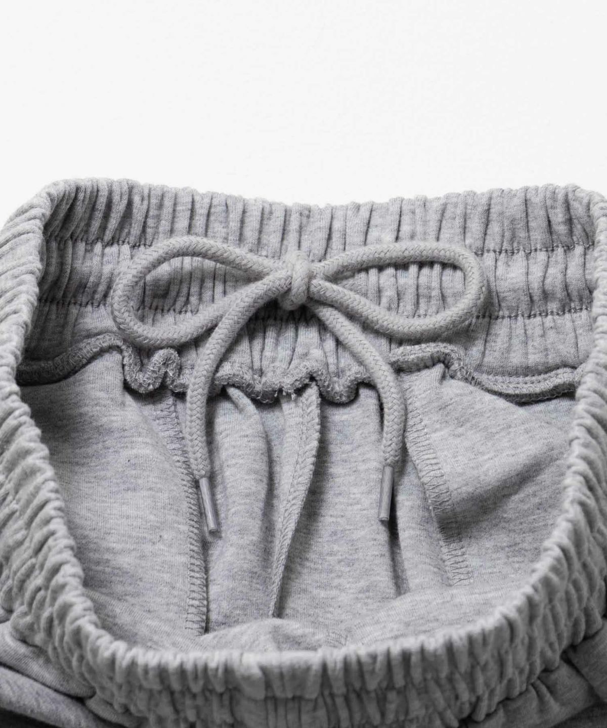 milli de l'air ポンチ素材 リラックスカーブパンツ レディース